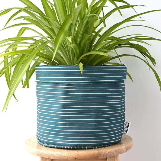 Cache pot en tissu horizon vert profond.