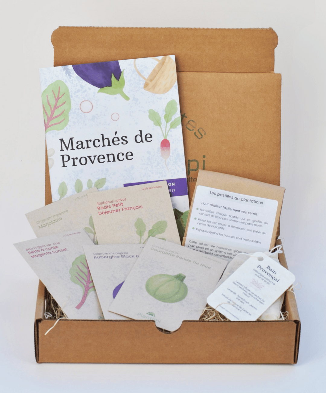 Contenu d’une boîte à planter Plantopi avec semences de saison, guide de jardinage et accessoires
